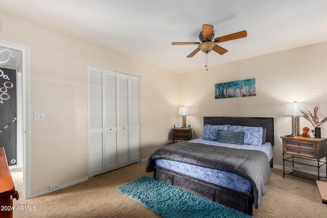 bedroom featuring a closet, ceiling fan, and light colored carpet