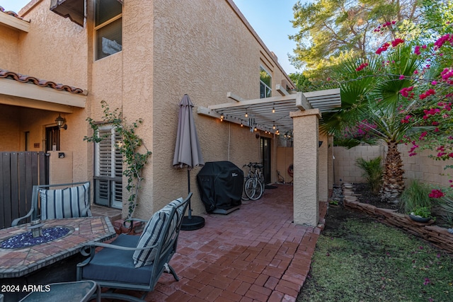 view of patio / terrace with a pergola and area for grilling