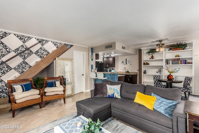 living room featuring ceiling fan and light tile patterned flooring