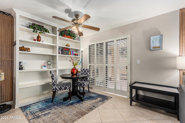 dining room with ceiling fan and light tile patterned floors