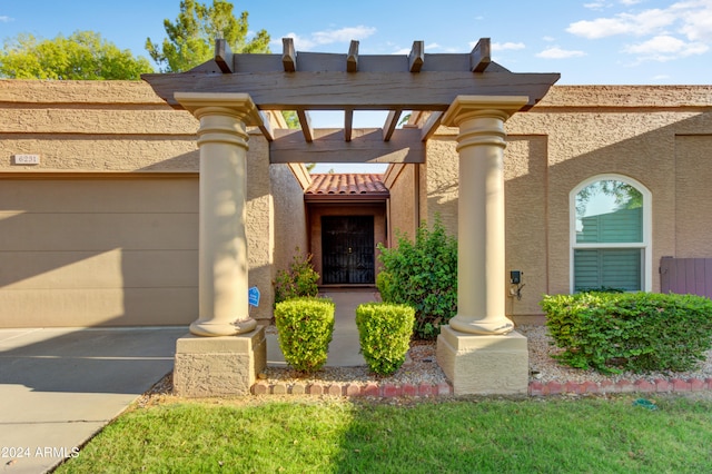 doorway to property with a garage