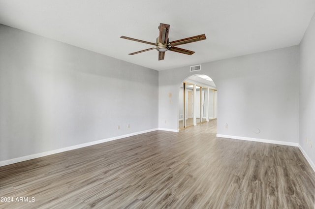 unfurnished room featuring wood-type flooring and ceiling fan