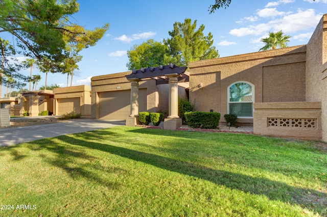 view of front of property featuring a garage and a front lawn