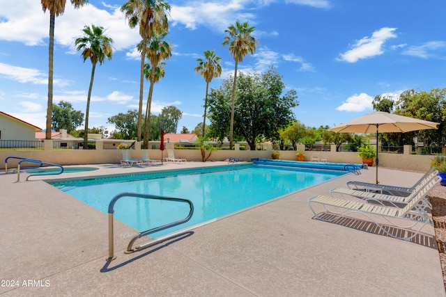 view of swimming pool with a patio