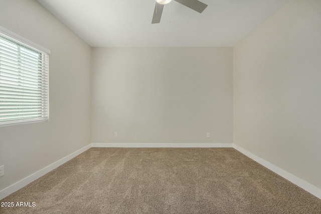 unfurnished room featuring carpet and ceiling fan