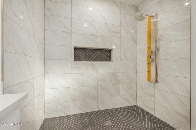 bathroom with tiled shower