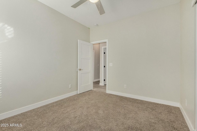 spare room with carpet flooring and ceiling fan