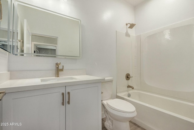 full bathroom featuring vanity, bathtub / shower combination, and toilet