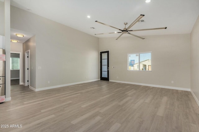 empty room with light hardwood / wood-style flooring