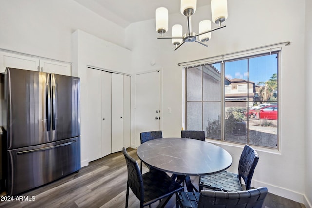 dining room featuring a notable chandelier and dark hardwood / wood-style flooring