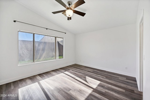 empty room featuring ceiling fan, dark wood-type flooring, and lofted ceiling