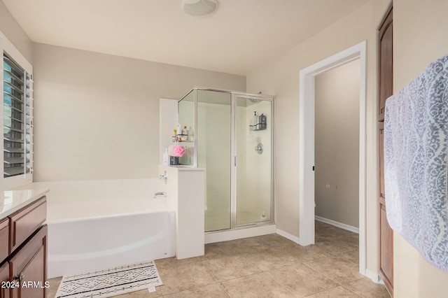 bathroom with vanity, tile patterned floors, and separate shower and tub