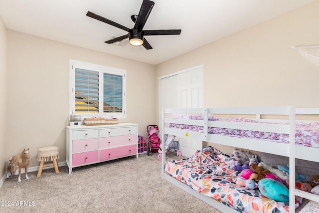 bedroom with light carpet, a closet, and ceiling fan