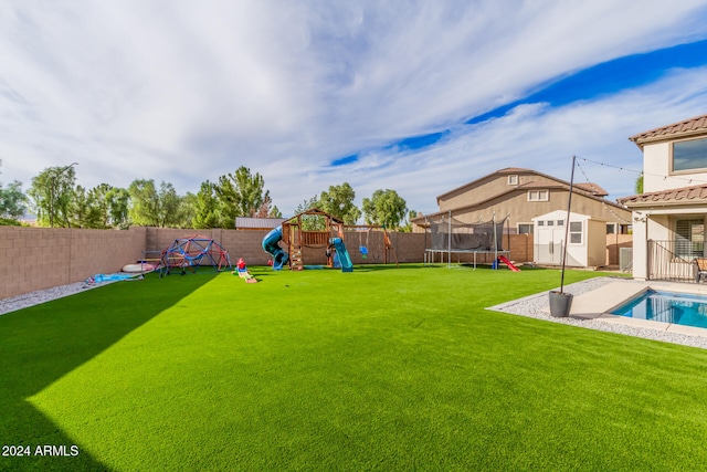 view of yard featuring a fenced in pool, a playground, a patio, and a trampoline