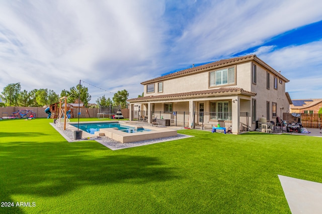 rear view of property featuring a fenced in pool, a playground, a patio, and a lawn