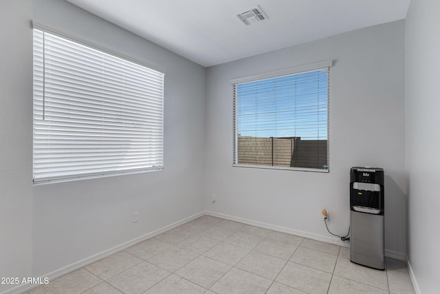 36257 W San Clemente Ave, Maricopa, AZ 85138 - spare room with baseboards, visible vents, and light tile patterned floors