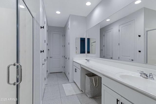 36257 W San Clemente Ave, Maricopa, AZ 85138 - full bathroom with tile patterned flooring, recessed lighting, a sink, a stall shower, and double vanity