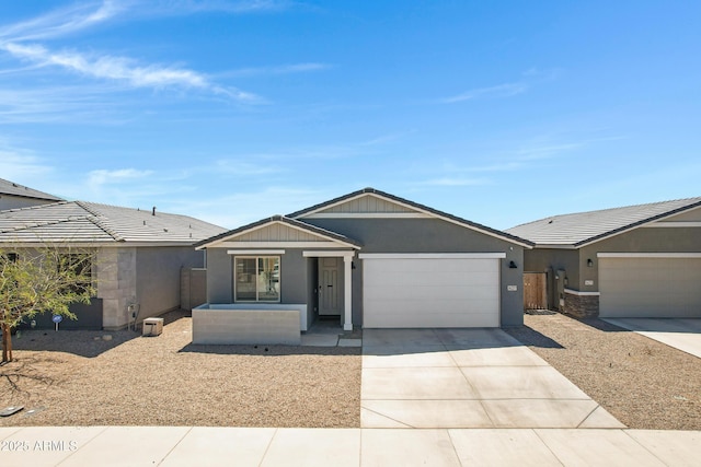 36257 W San Clemente Ave, Maricopa, AZ 85138 - ranch-style home with stucco siding, an attached garage, and concrete driveway