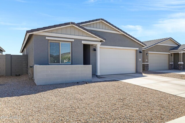 36257 W San Clemente Ave, Maricopa, AZ 85138 - view of front of home featuring driveway, fence, and an attached garage