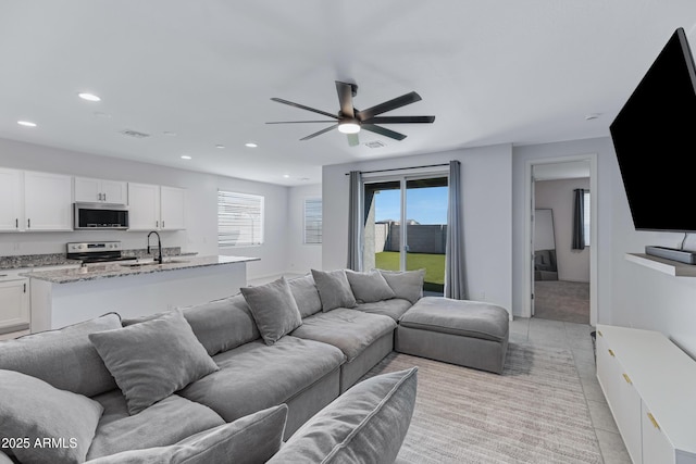 36257 W San Clemente Ave, Maricopa, AZ 85138 - living room featuring a ceiling fan, recessed lighting, light tile patterned floors, and a wealth of natural light