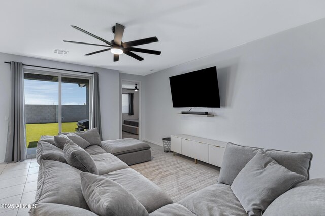 36257 W San Clemente Ave, Maricopa, AZ 85138 - living room featuring baseboards, visible vents, light tile patterned floors, and a ceiling fan