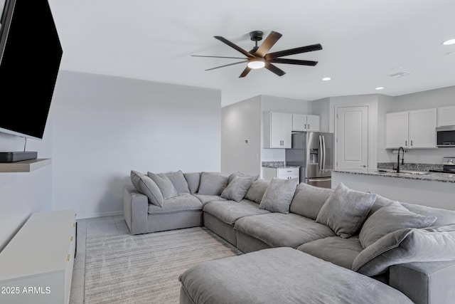 36257 W San Clemente Ave, Maricopa, AZ 85138 - living area with light carpet, baseboards, ceiling fan, and recessed lighting