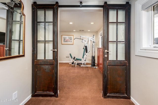 exercise room with carpet floors, recessed lighting, and baseboards