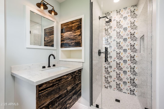 full bath featuring a shower stall and vanity