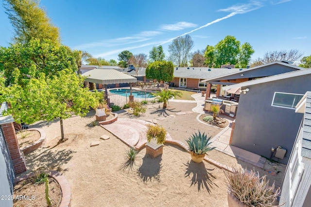 view of yard featuring a patio area and an outdoor pool