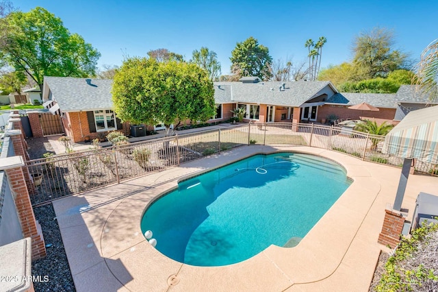 view of swimming pool featuring a fenced in pool, a patio area, and fence