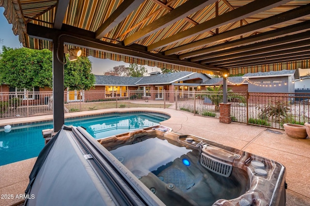 view of pool featuring an outdoor hot tub, fence, a fenced in pool, and a patio