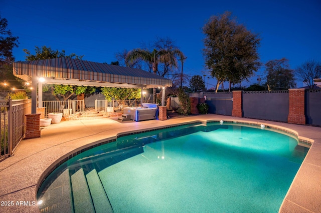 pool at twilight featuring a fenced in pool, a fenced backyard, a patio, and a gazebo