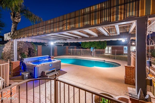 pool at twilight with a patio, fence, a fenced in pool, and a hot tub