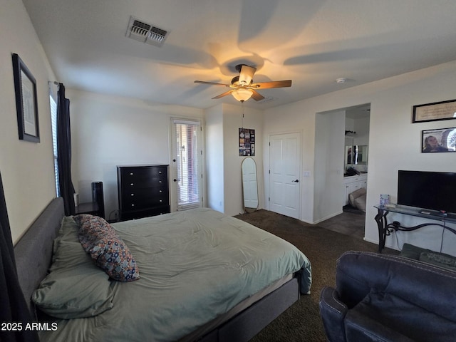 bedroom with ceiling fan and dark colored carpet