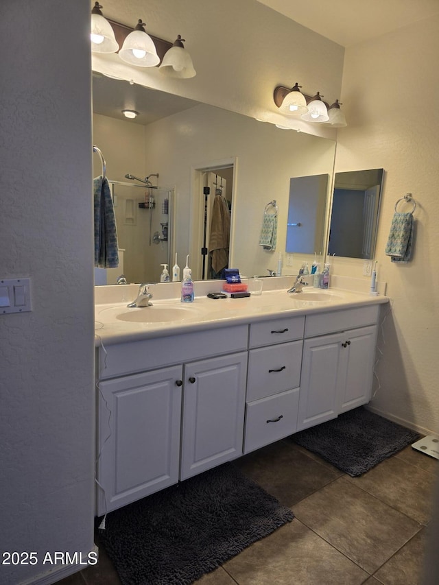 bathroom with tile patterned floors and vanity