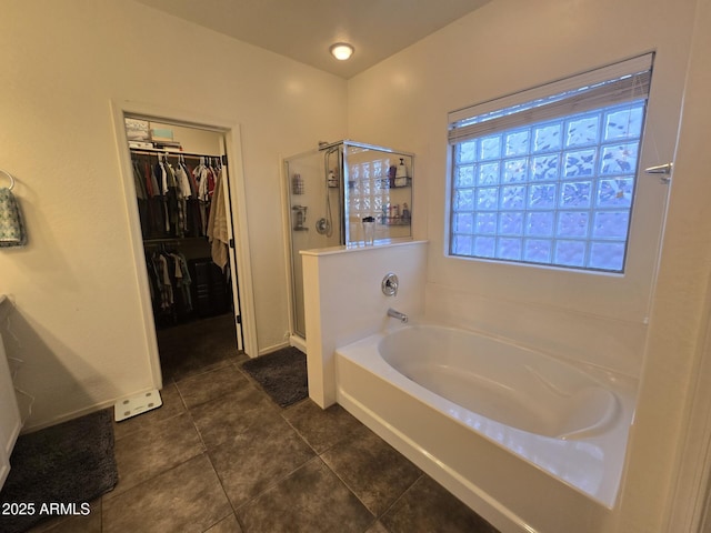 bathroom featuring plus walk in shower and tile patterned floors