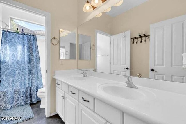 bathroom with vanity, a shower with curtain, and toilet