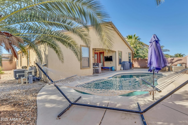 view of swimming pool featuring central AC, grilling area, and a patio