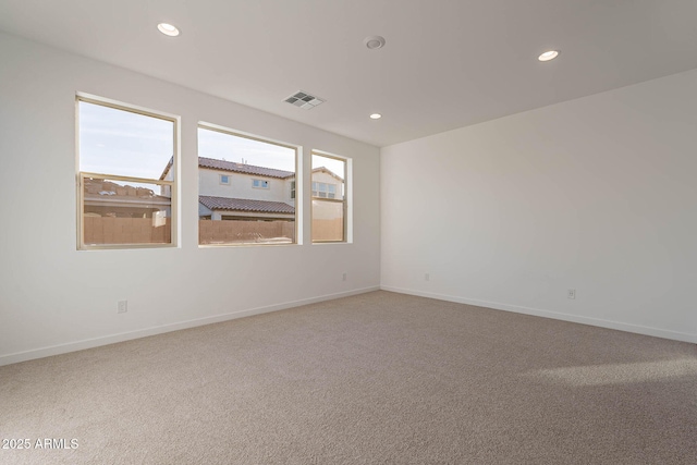 unfurnished room featuring carpet flooring