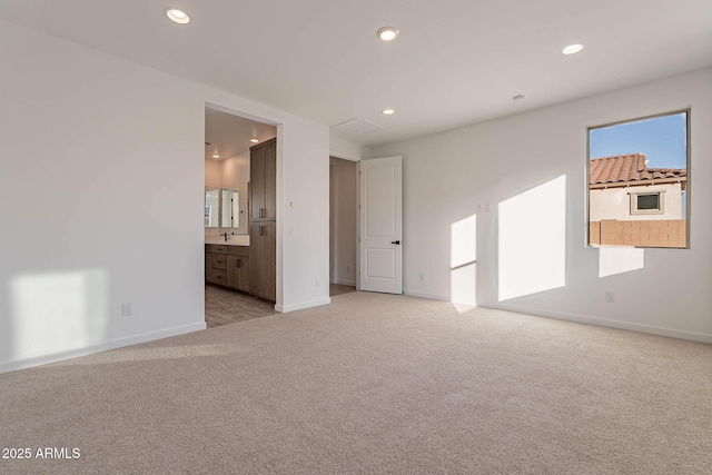 empty room featuring light colored carpet