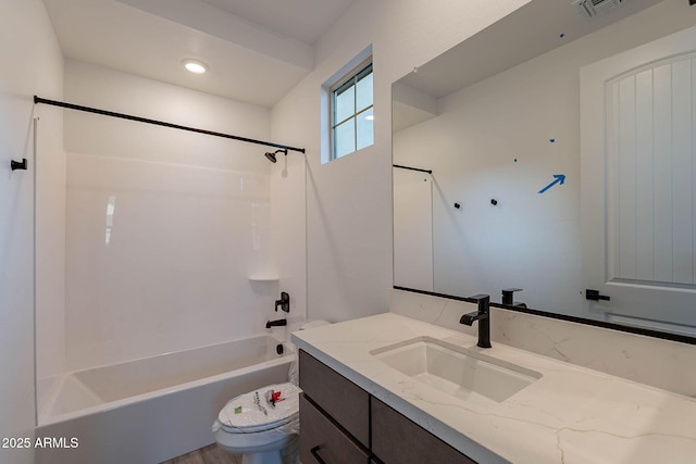 full bathroom featuring vanity, shower / tub combination, and toilet