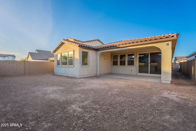 rear view of house with a patio