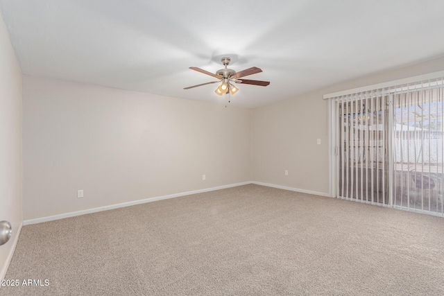 unfurnished room featuring carpet, ceiling fan, and baseboards