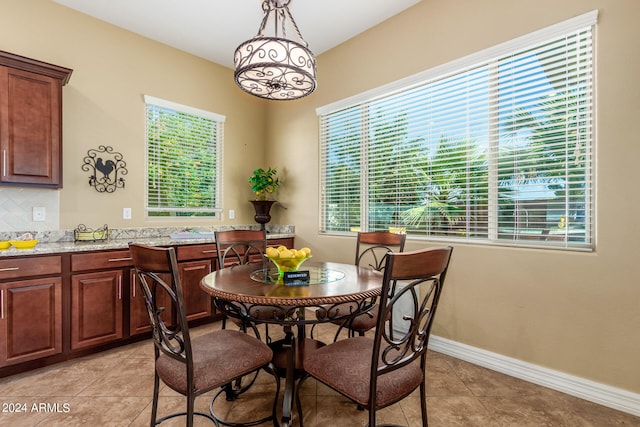 dining area featuring a wealth of natural light and light tile patterned floors