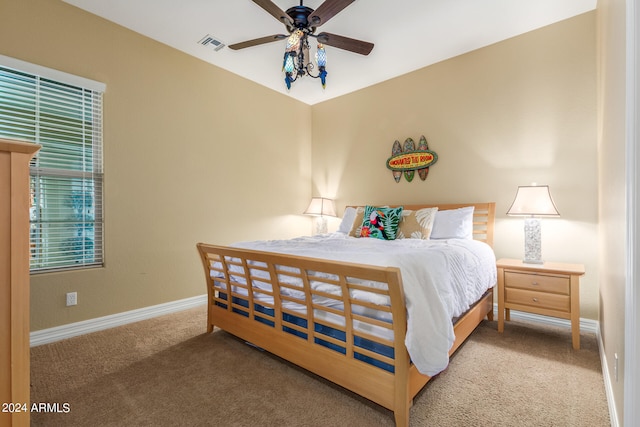 carpeted bedroom with ceiling fan