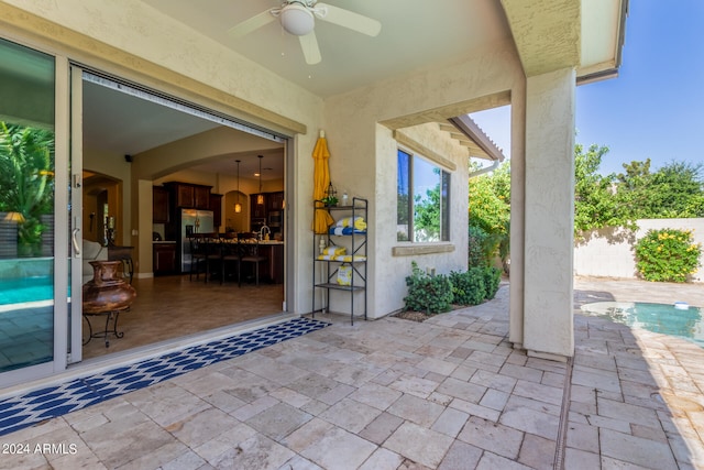 view of patio / terrace featuring ceiling fan