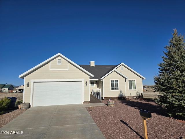 single story home with driveway, a garage, and a chimney