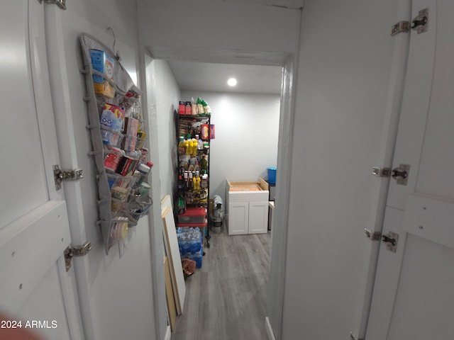 hallway with light wood-style floors