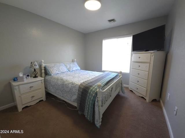 carpeted bedroom with baseboards and visible vents