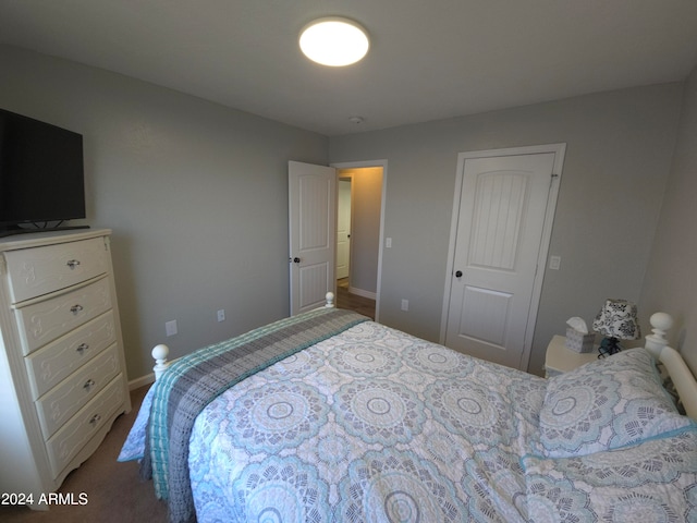 bedroom with carpet floors and baseboards